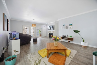 Spacious living/dining area with abundance of natu