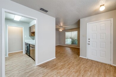 Foyer with ceiling fan, beverage cooler, a texture