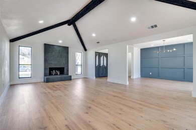 Unfurnished living room featuring light wood-type 