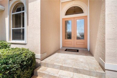 Beautiful front door and arched windows