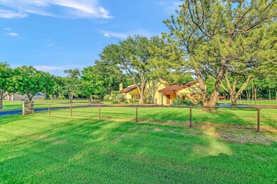 The property is fenced with pipe and cable with an area ready for horses that includes a loafing shed.