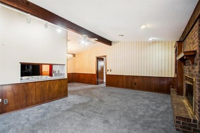 Unfurnished living room with carpet, ceiling fan, 