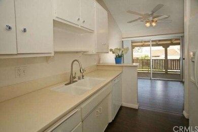 kitchen opens to dining / living area and balcony.