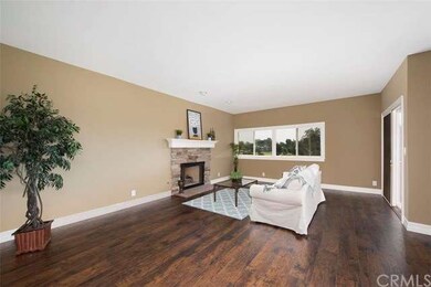 Living room with Arizona stone fireplace, and view