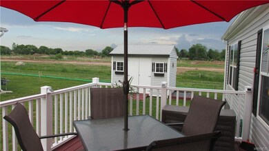 Spacious deck also showing 8 x 12 shed with garden