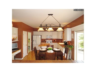 Pretty as a Picture White Kitchen with Hardwood Fl