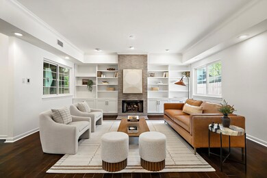 Living area with baseboards, visible vents, hardw