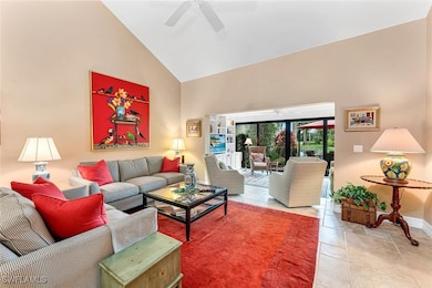 Living room with high vaulted ceiling, tile patter
