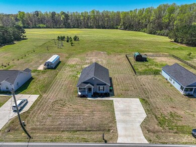 Birds eye view of property with a rural view
