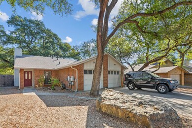 Ranch-style house featuring brick siding, a chimney, driveway, roof with shingles, and an attached garage
