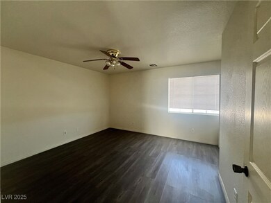 Unfurnished room with dark wood finished floors, c