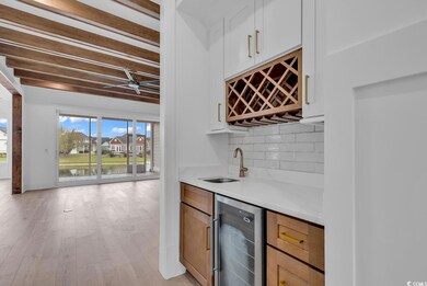 Bar featuring light hardwood / wood-style floors, 