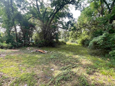 View of yard featuring a forest view