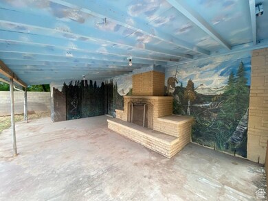 View of patio / terrace featuring an outdoor fireplace