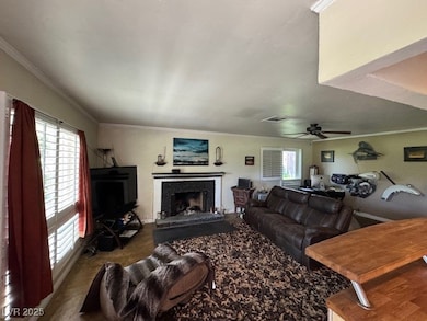 Living area featuring a fireplace with raised hear