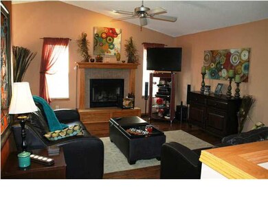 Living Room with new flooring, a woodburning firep