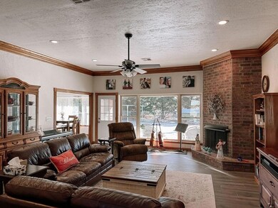 Large open concept living room with corner firepla