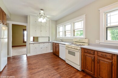Built-ins in the kitchen open to the dining room a