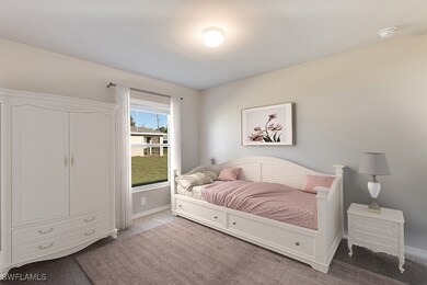 Carpeted bedroom featuring baseboards