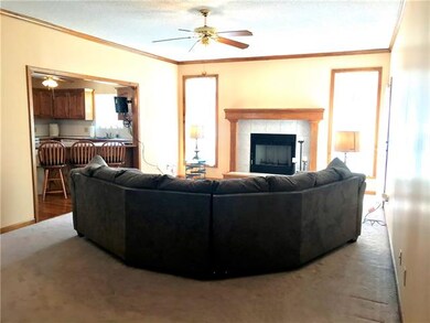 Fireplace in living room has never been used.