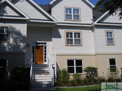 Front Entry with gorgeous oak door, side lights, a