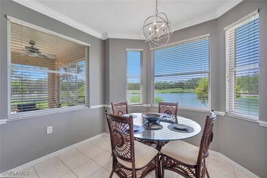 Dining room with a chandelier, light tile patterne