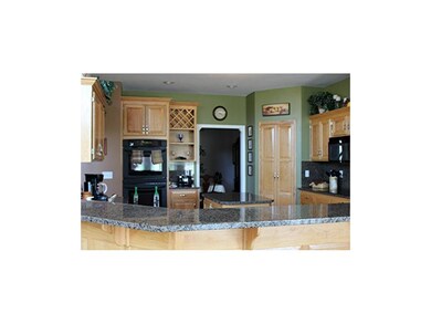 Built-in wine rack, double ovens, granite counters