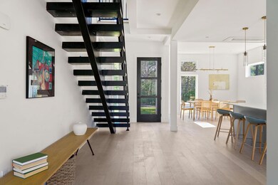 Entrance foyer featuring wood finished floors and
