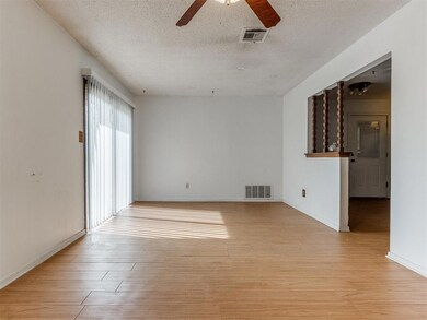 Unfurnished room with light wood-type flooring, ce