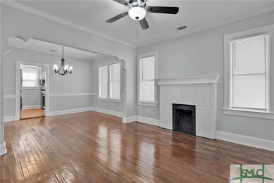 The living room is 12' X 12'6 with original mantel