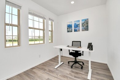 A perfect office in the the front of your home with natural light ideal for remote work or study with natural light streaming through the windows.