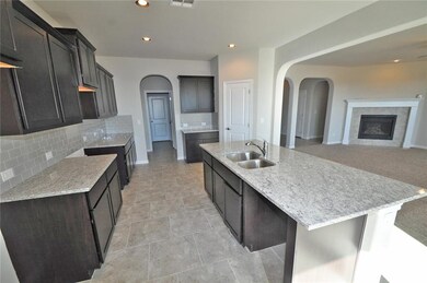 With a pantry for storage and a breakfast bar for 