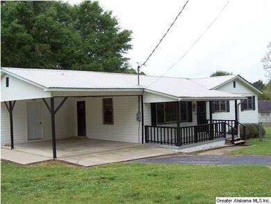 Front view of house with 2 car carport