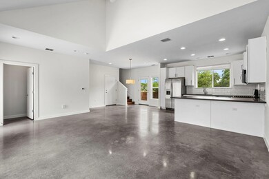 Unfurnished living room featuring visible vents, 