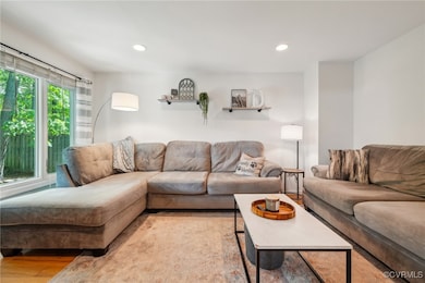Living area with recessed lighting and wood finish