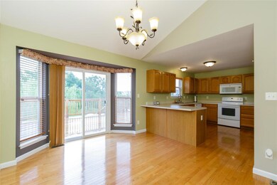 The dining area has a bay window area with sliding