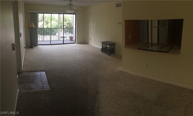 Empty room featuring ceiling fan and carpet floori