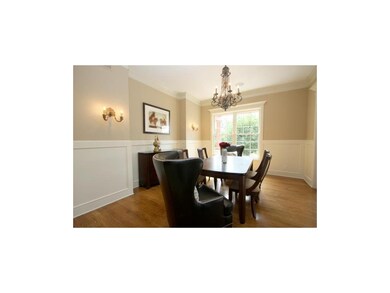 Discover extensive moldings and fine wainscoting