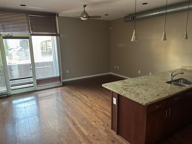 Kitchen with ceiling fan, pendant lighting, wood-t