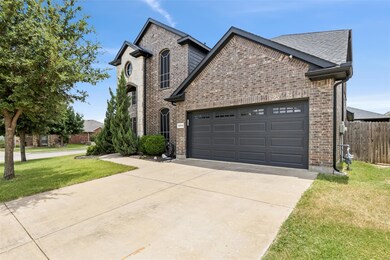 View of front of house with a garage and a front l