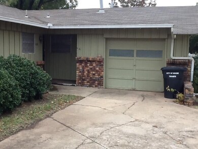 Covered front entrance with attached 1 car garage.