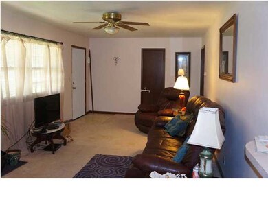 A large living space with large windows allowing n
