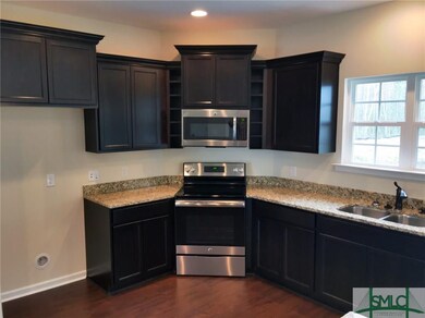 Beautiful dark cabinets with granite counters and 