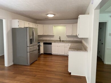 KITCHEN OPEN TO EATING AREA