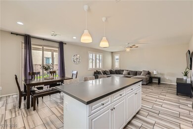 Kitchen with a kitchen island, hanging light fixtu