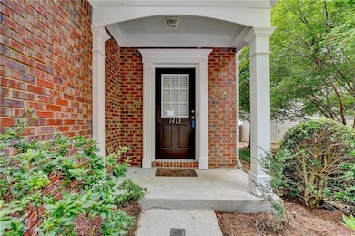 Entrance to property with brick siding