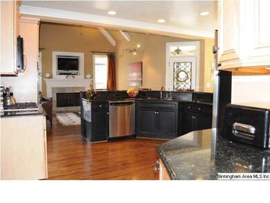 View of breakfast bar in kitchen and through into 