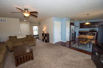 Living room and kitchen are open to each other.