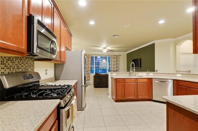 Stainless Appliances and Tile Floor