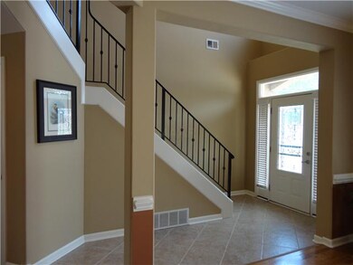 Large Tiled Entry with Wrought Iron Railing .. .Co